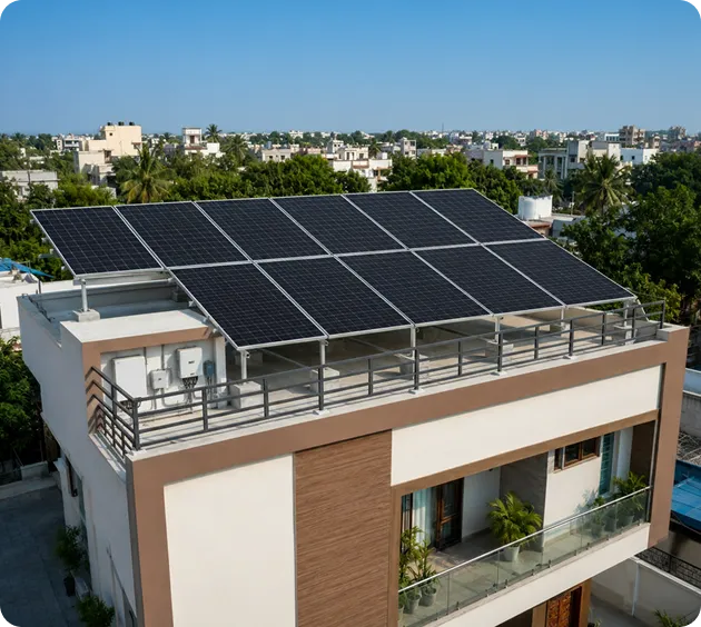 Modern Indian home with a 5.5kW rooftop solar system installed on an elevated terrace mounting structure for efficient residential solar power generation.