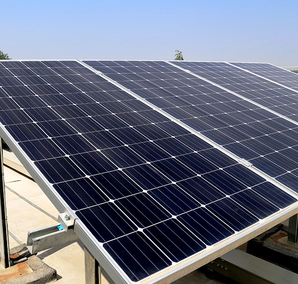 Installing solar panels on a rooftop in Ahmedabad