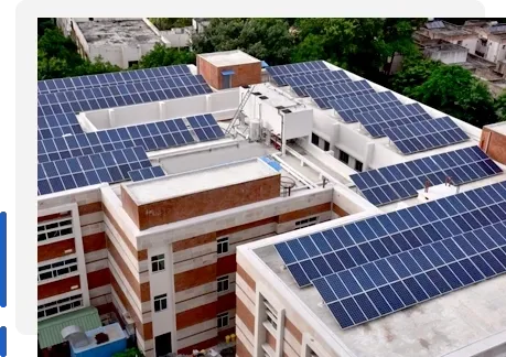 Housing society rooftop solar power system installed on multi-story residential building in India