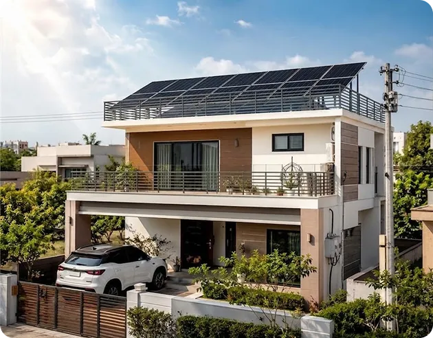 Two-storey Indian home with a rooftop solar panel installation mounted on an elevated terrace structure for sustainable energy generation.